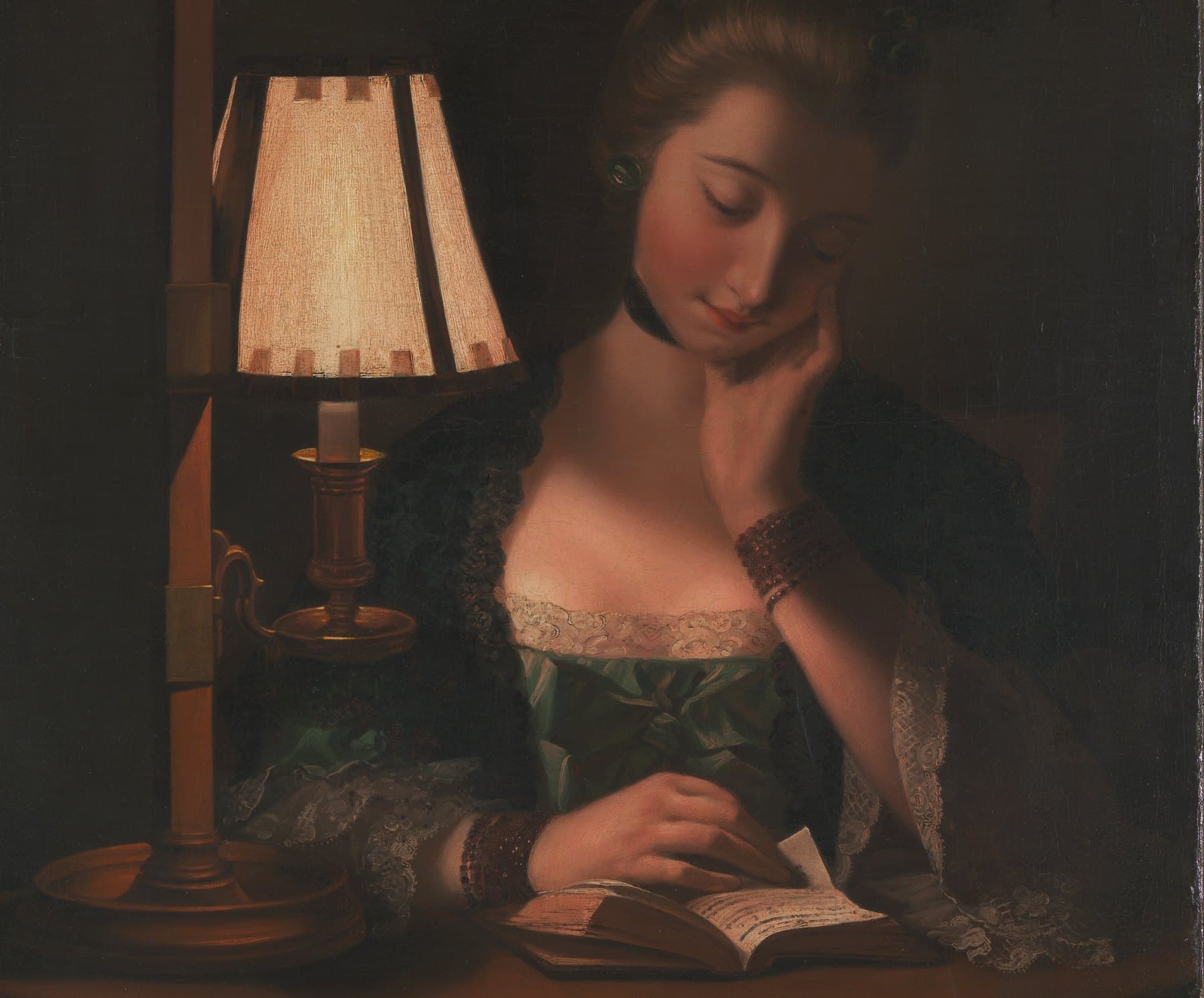 Painting: a woman reads a small book at night beside a candle under a paper lamp shade